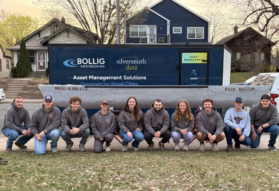 Minnesota State University, Mankato students with their student-built concrete canoe.